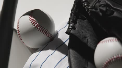 Close-Up-Studio-Baseball-Still-Life-With-Bat-Ball-Catchers-Mitt-And-Team-Jersey